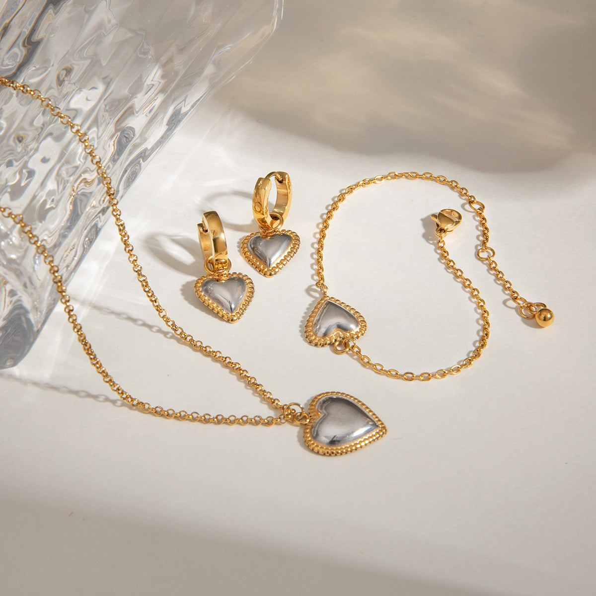 Two tones heart earrings