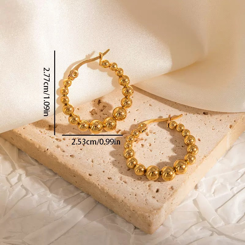 Reminiscence hoops earrings