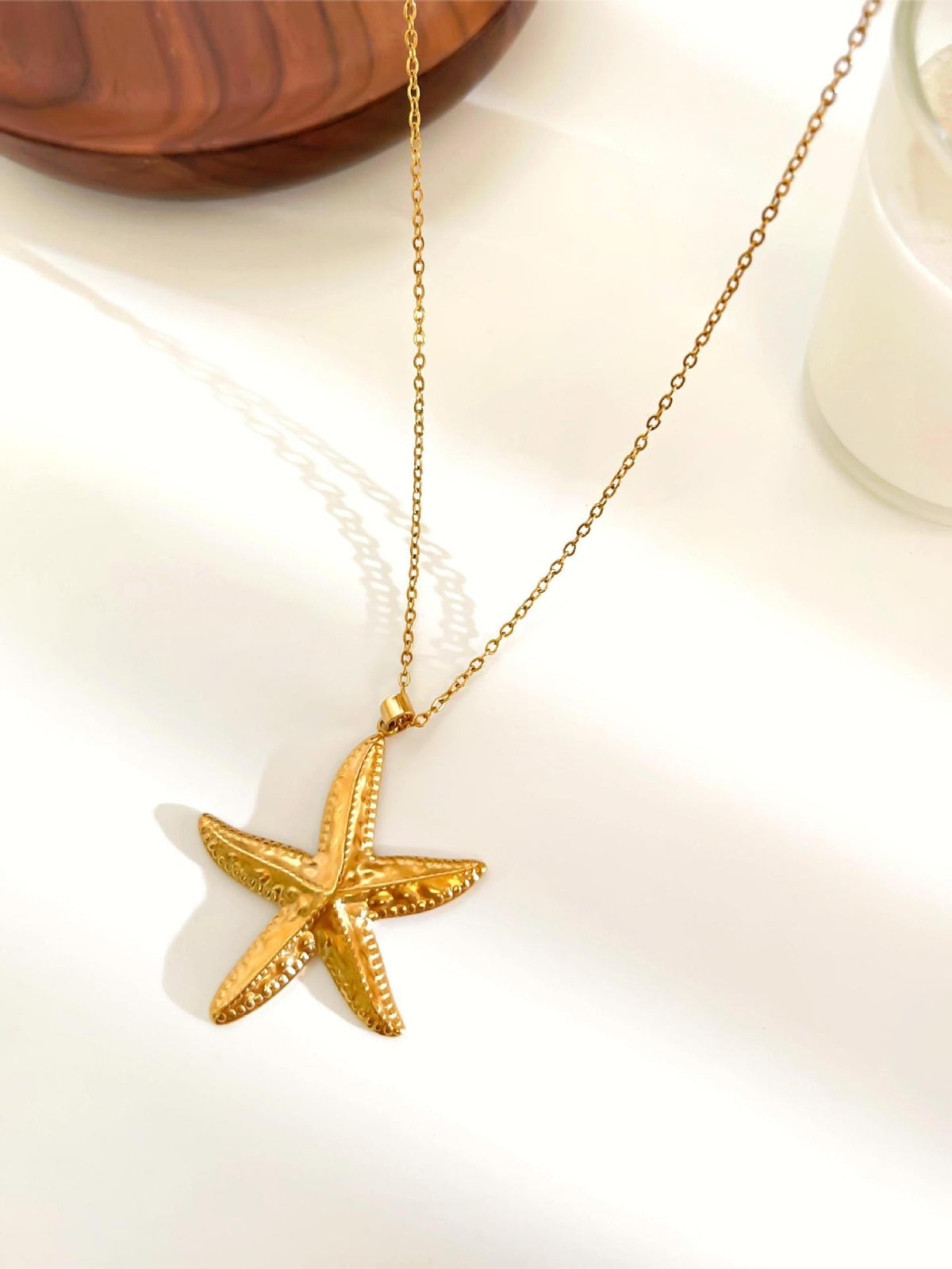 Pink starfish charm necklace