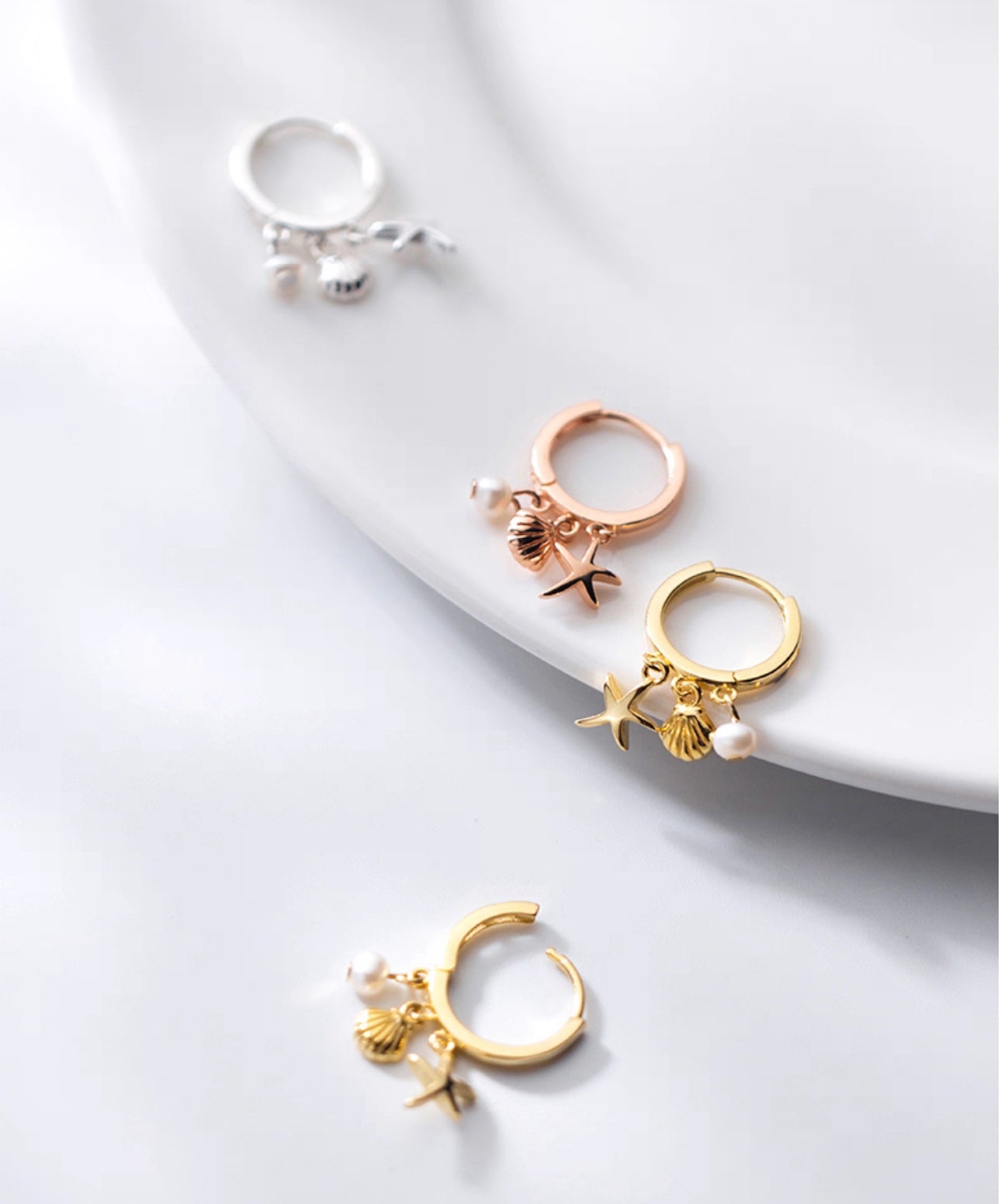 Dainty sterling silver starfish hoops