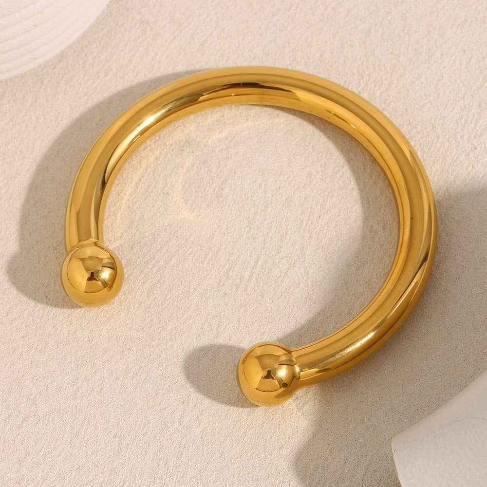 Gold beady statement bangle