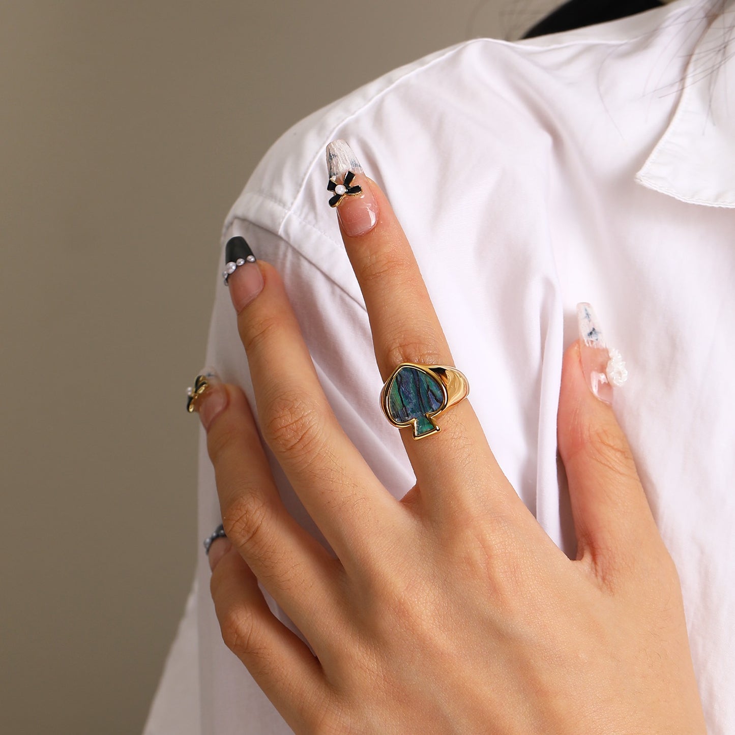 Poker face heart ring