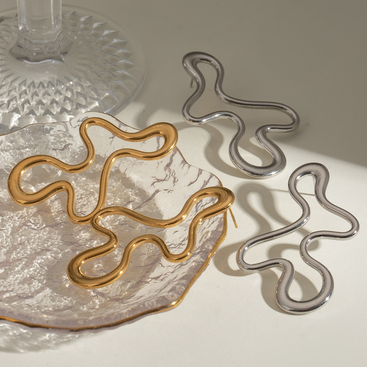 Melting lines earrings