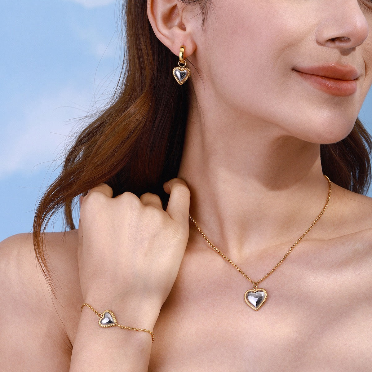 Two tones heart earrings