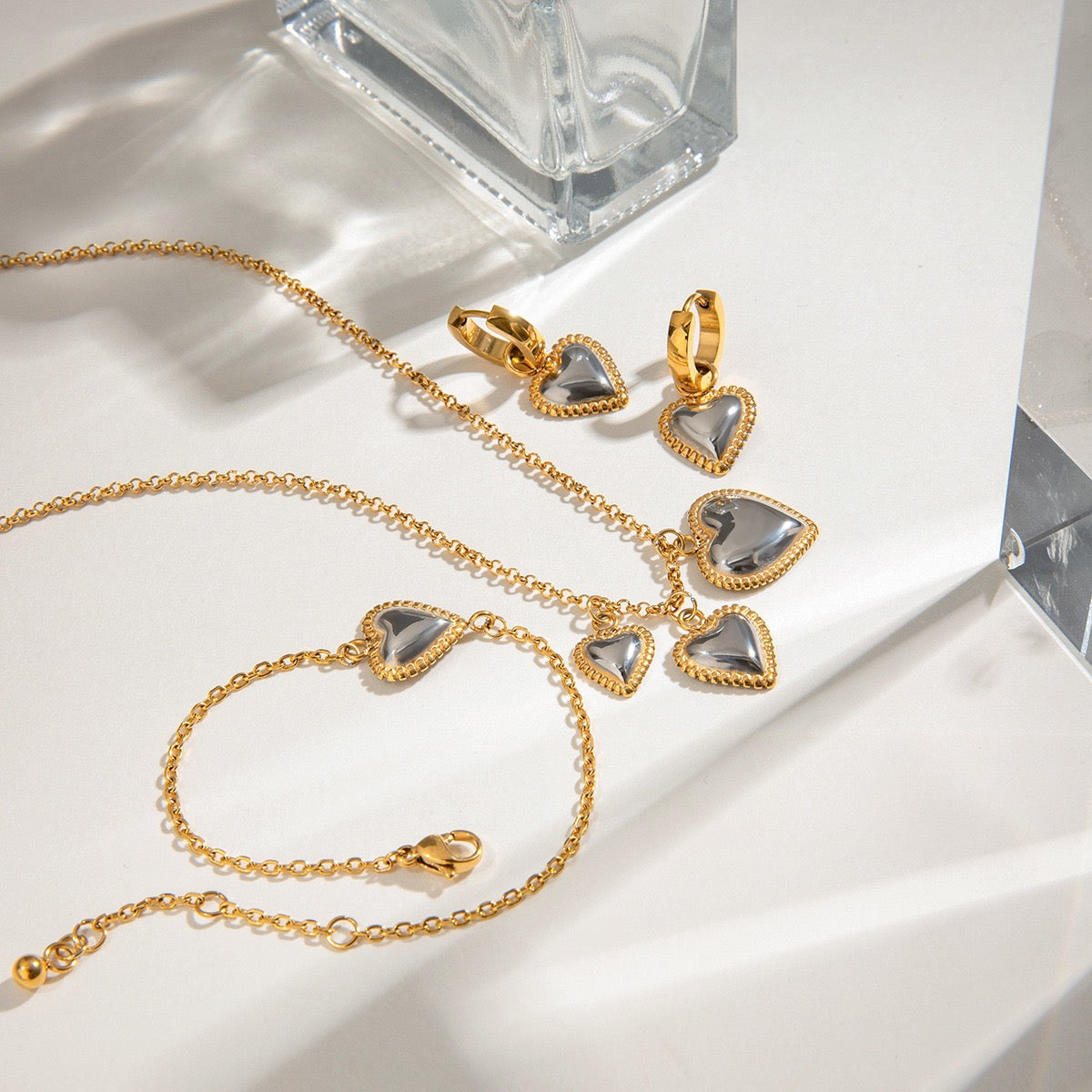 Two tones heart earrings