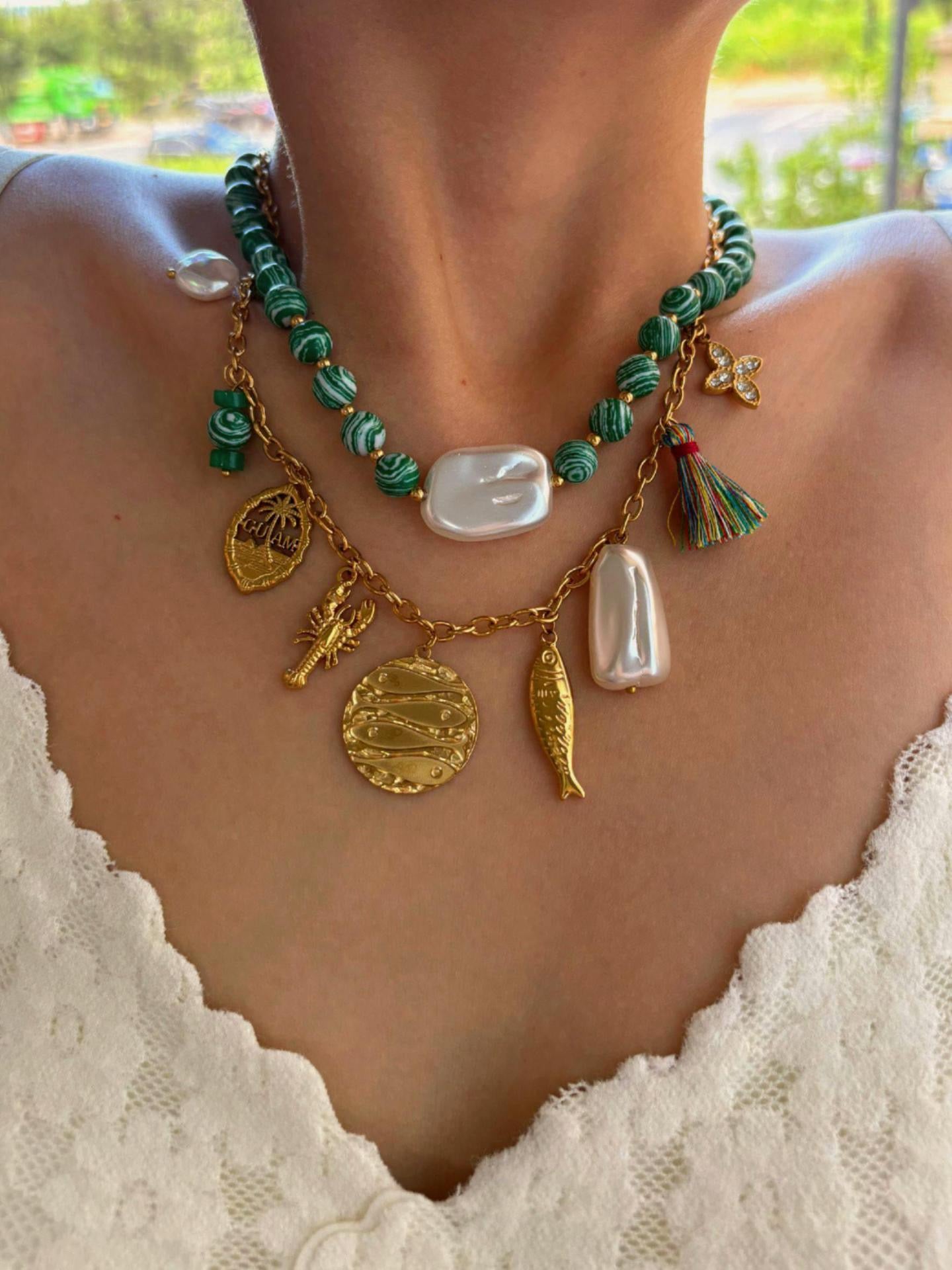 Green fish charm necklace