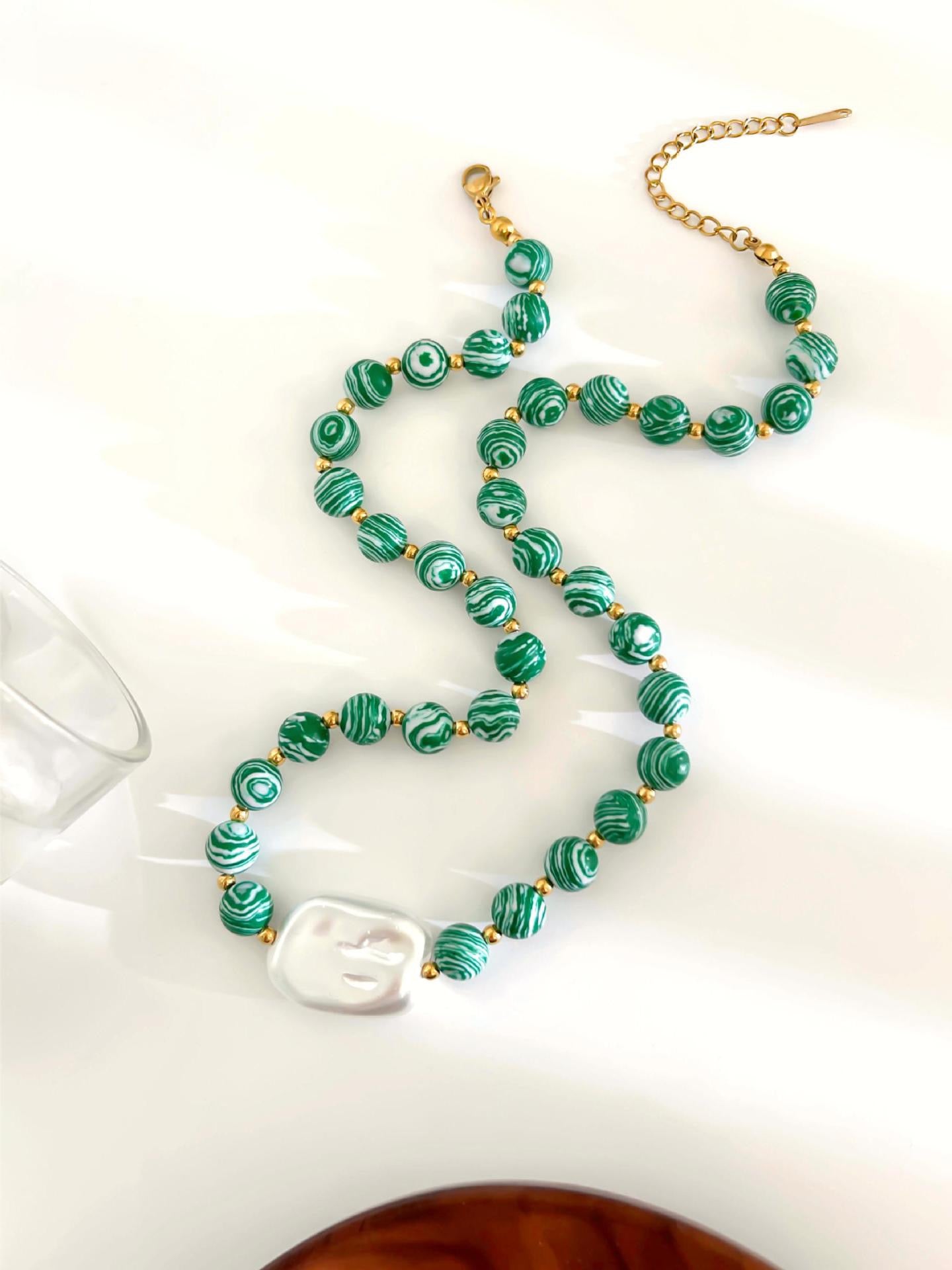 Green fish charm necklace