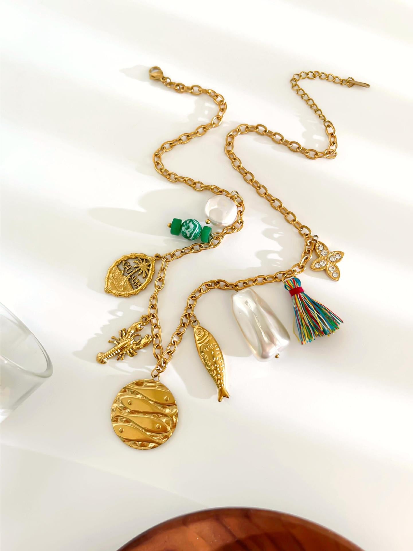 Green fish charm necklace