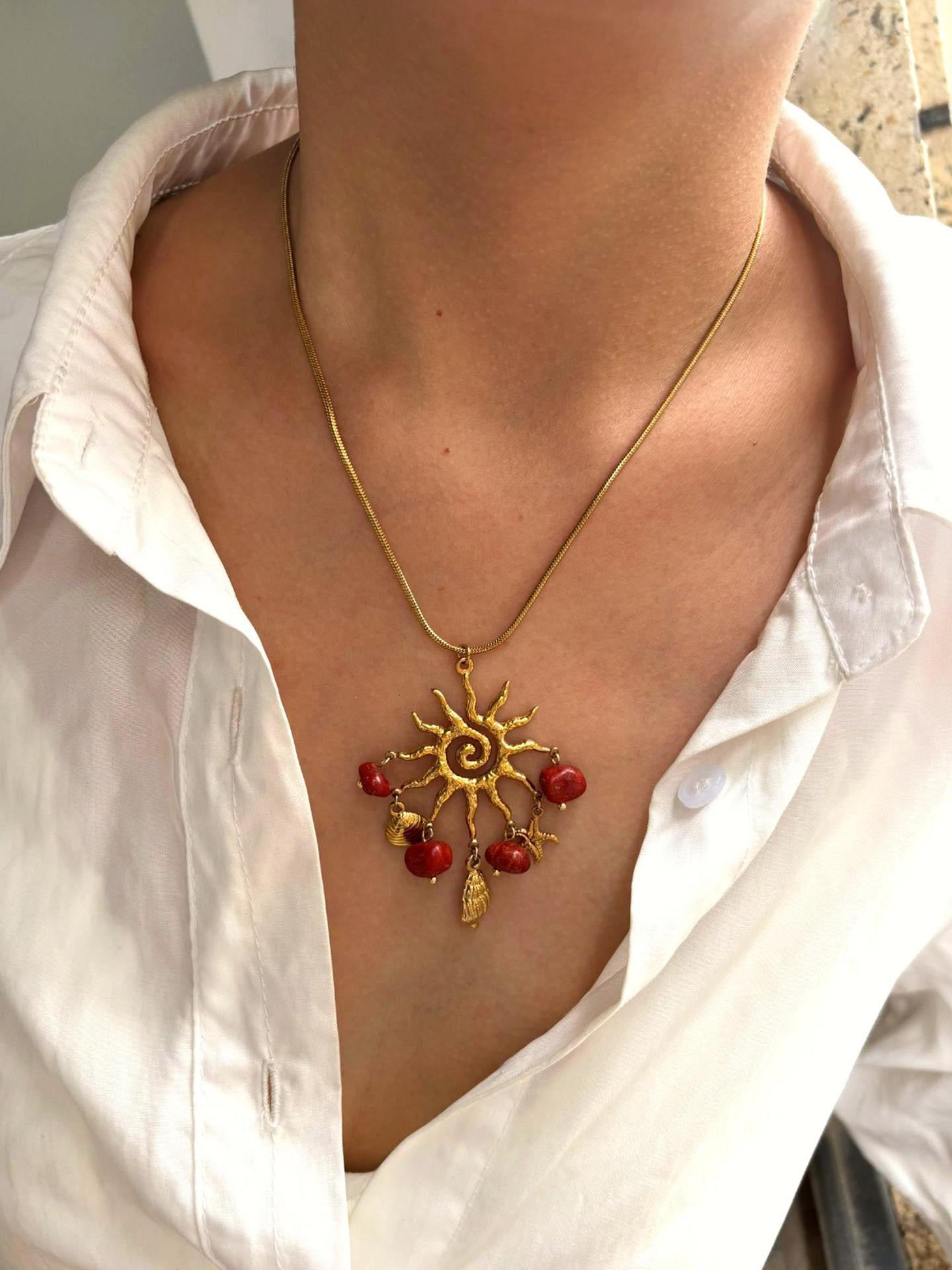 Red sun charm necklace