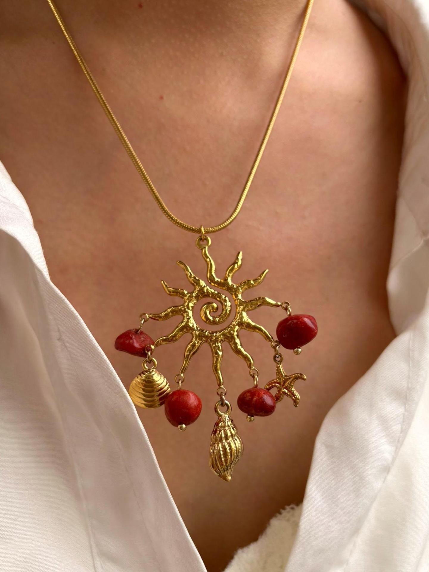 Red sun charm necklace