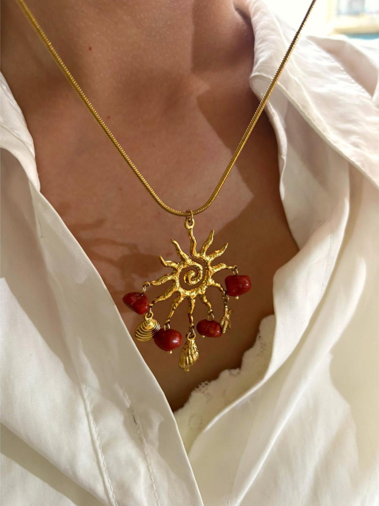 Red sun charm necklace