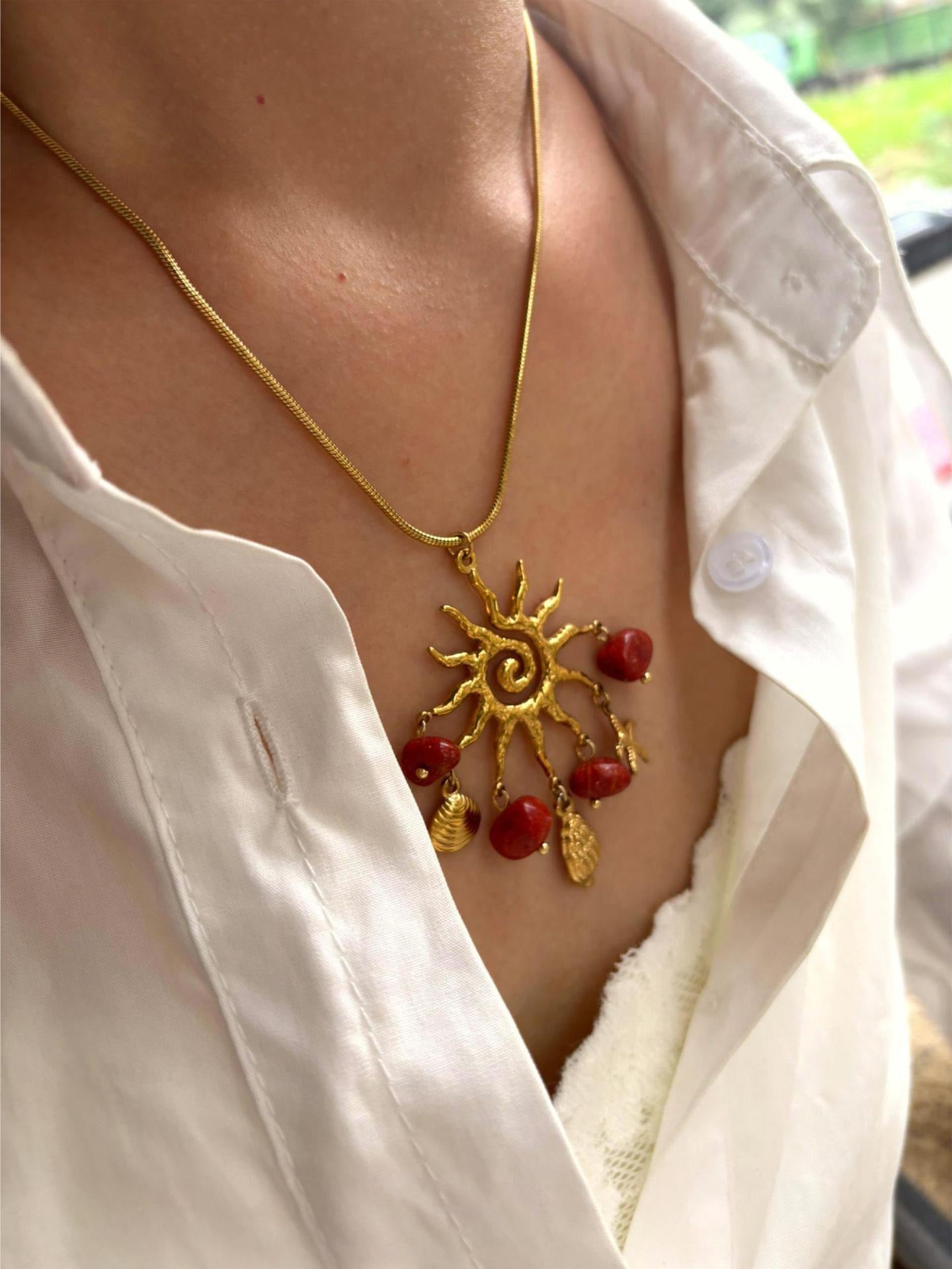 Red sun charm necklace
