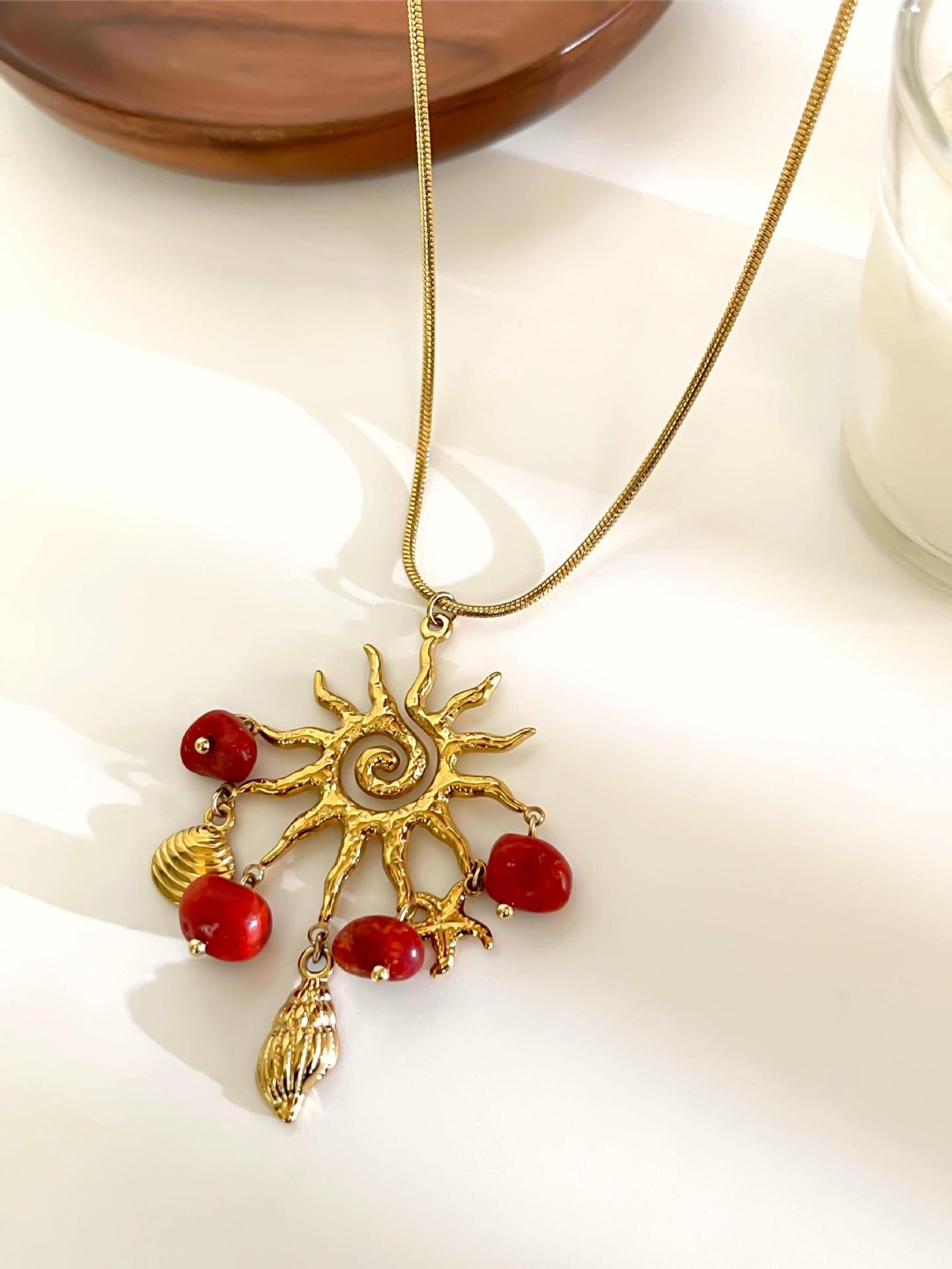 Red sun charm necklace