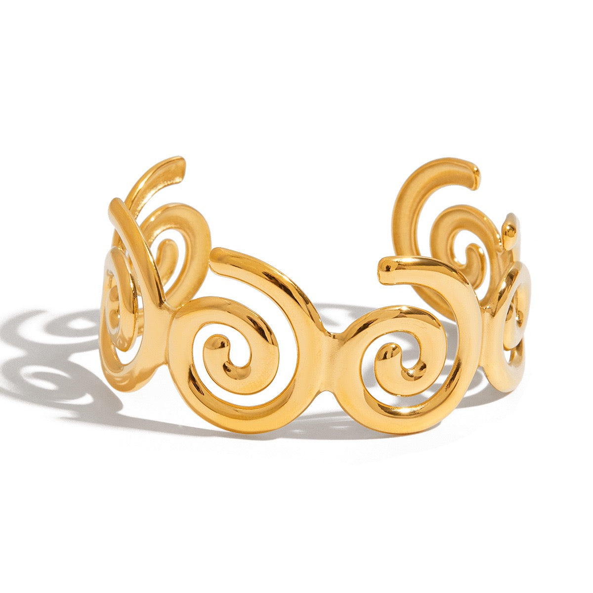 Swirl gold bangle