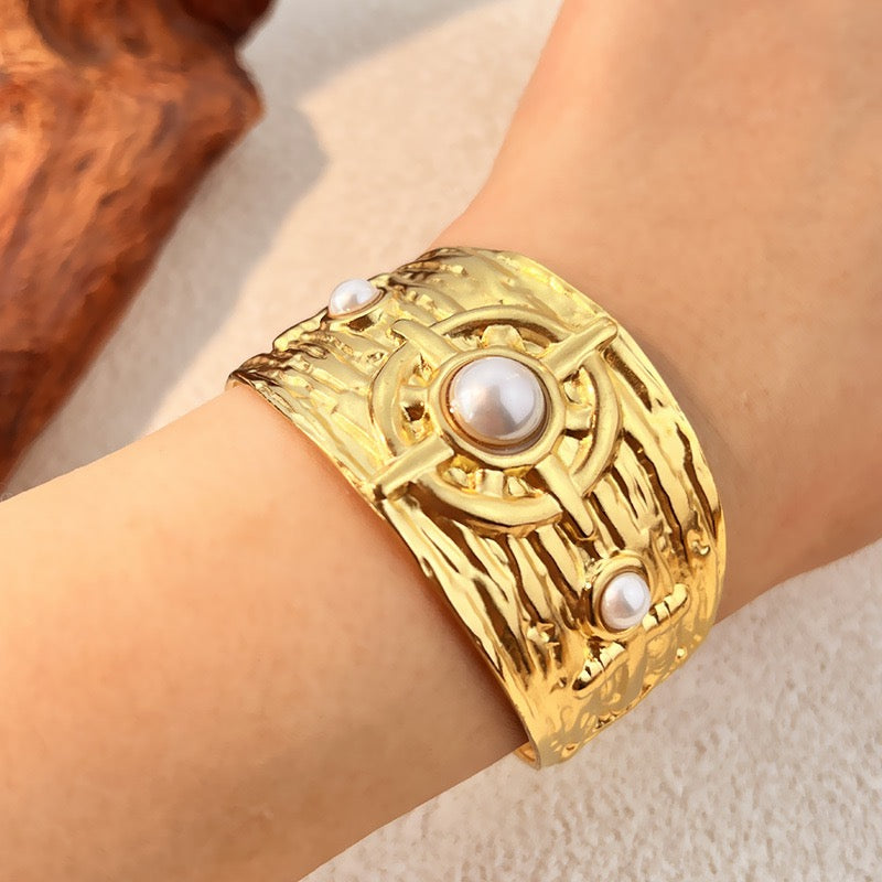 Pearly statement bangles