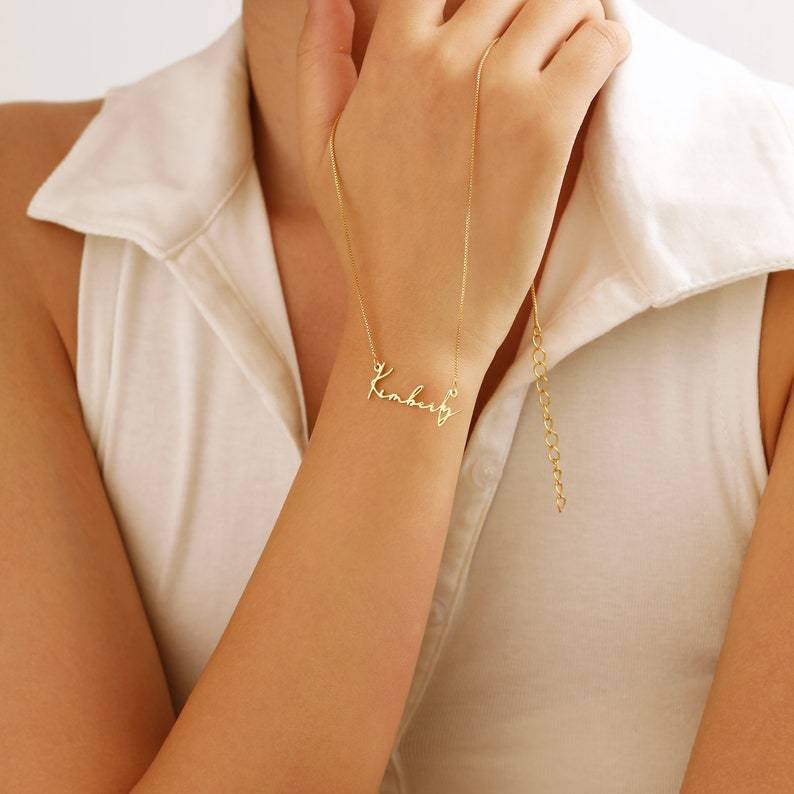 A customized name necklace stainless steel with gold plating