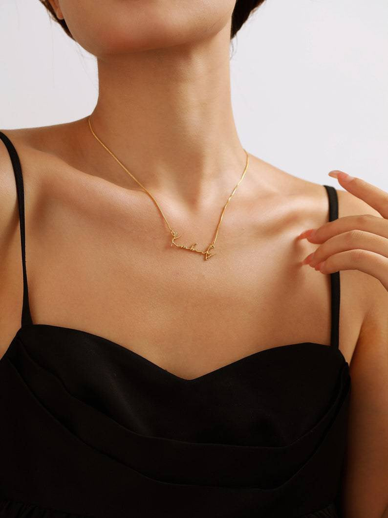 A customized name necklace stainless steel with gold plating