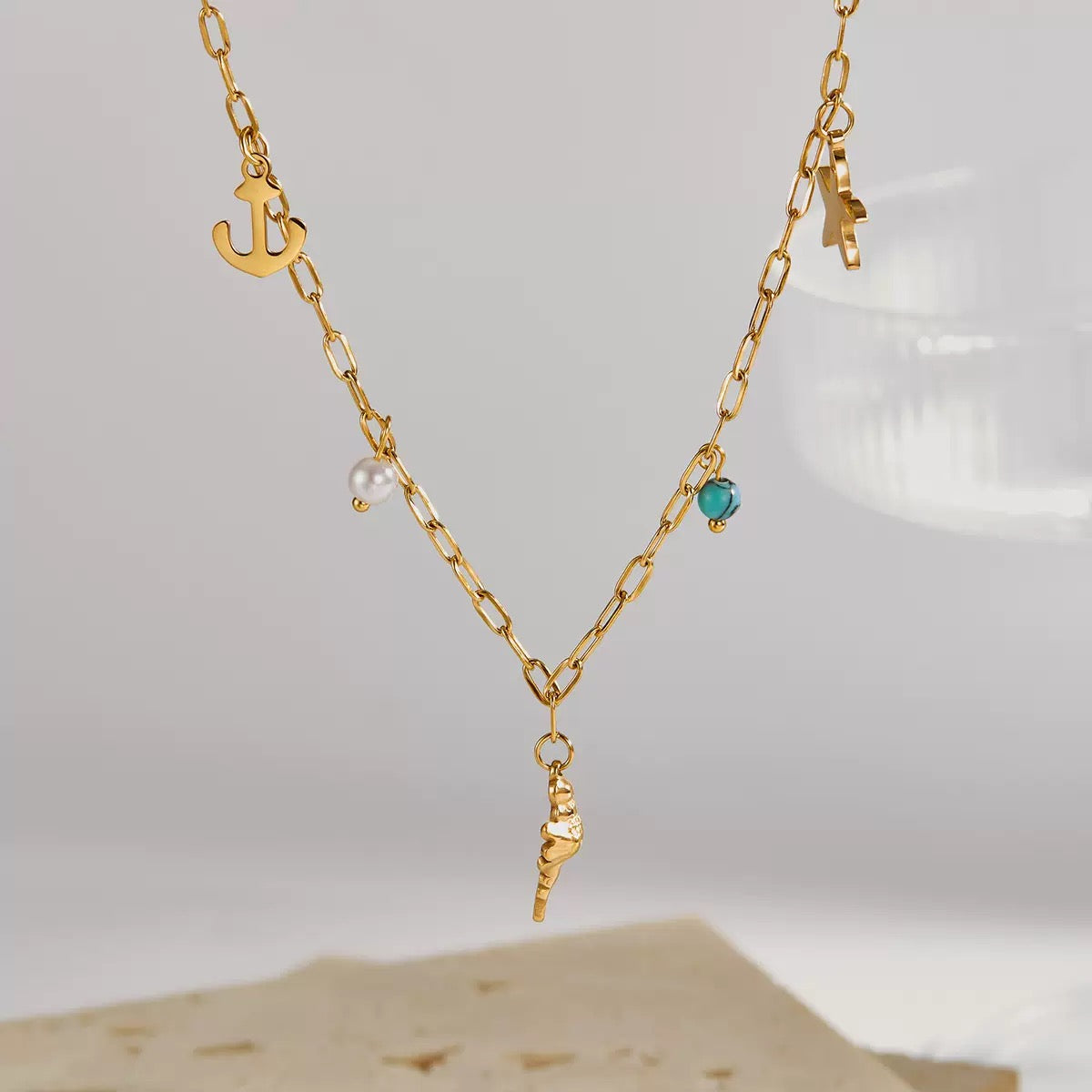 Dainty anchor shell charm necklace