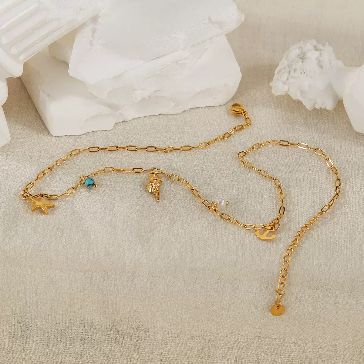 Dainty anchor shell charm necklace