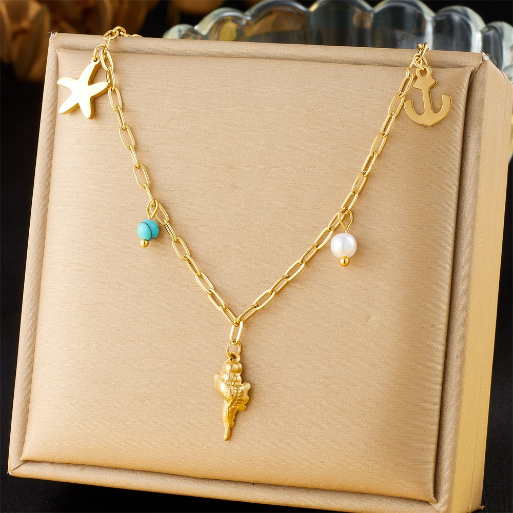 Dainty anchor shell charm necklace