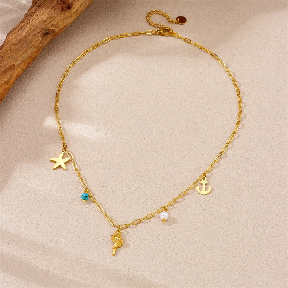 Dainty anchor shell charm necklace