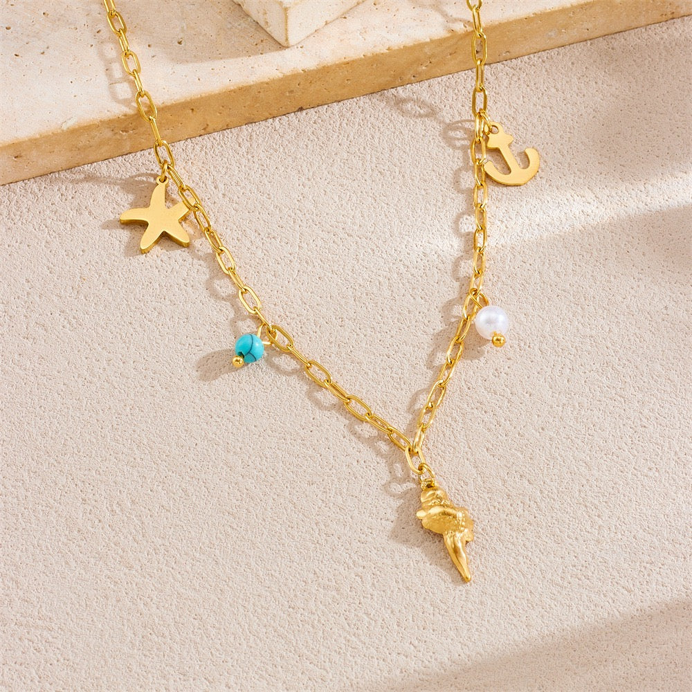 Dainty anchor shell charm necklace