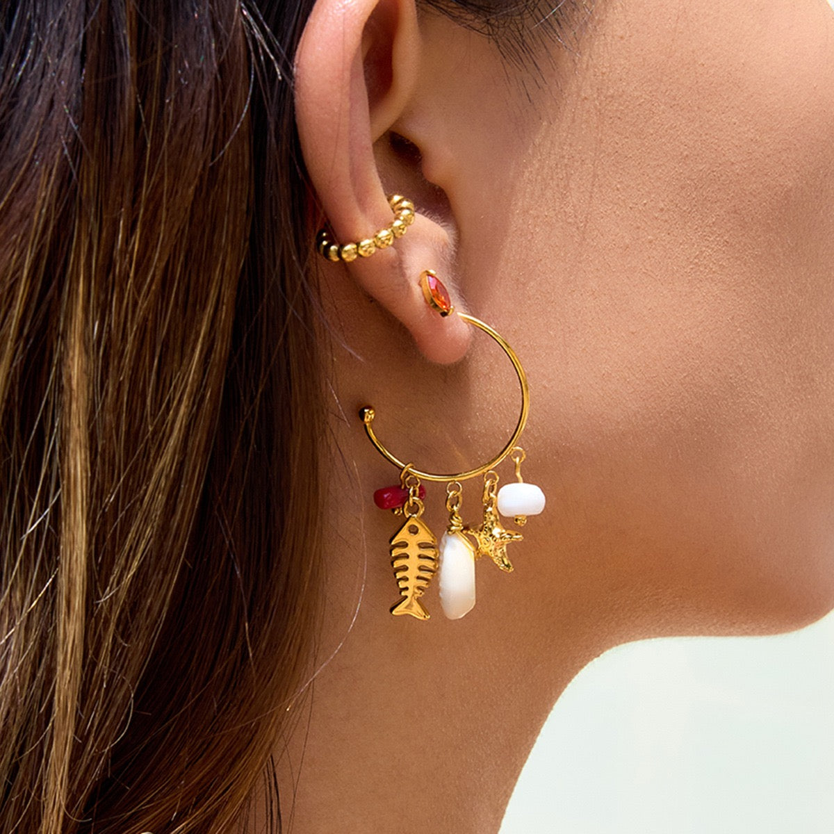 Dangling coral fish earrings